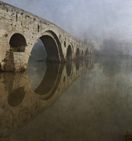 Roman bridge into mist